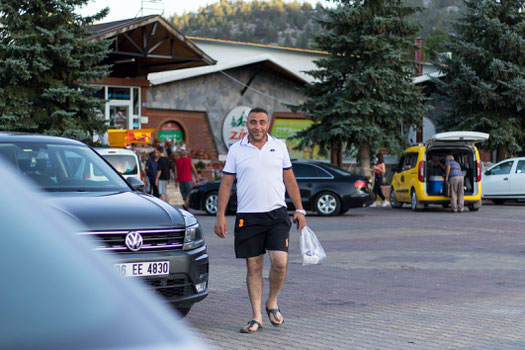 Yasin coming back from the restaurant with nuts for us