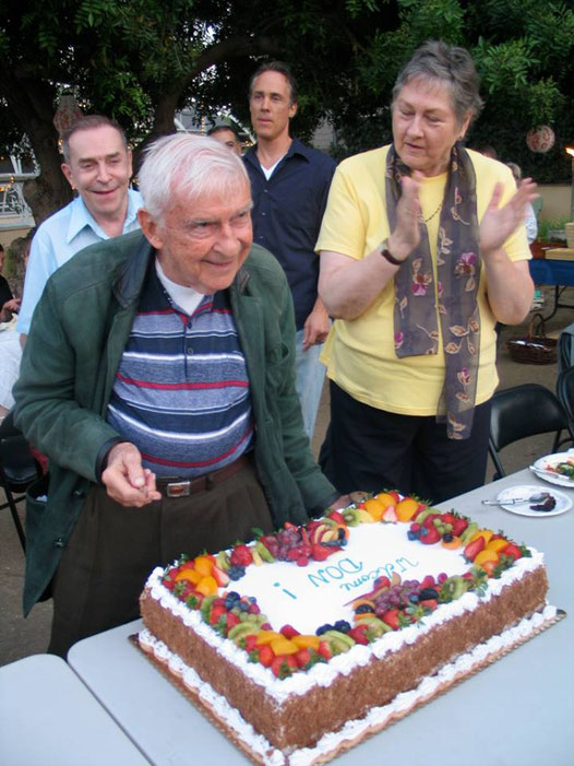 Don is cutting the Cake in Los Angeles with Ed Flanagan, Richard Alton Stermer and Linda Zavala.