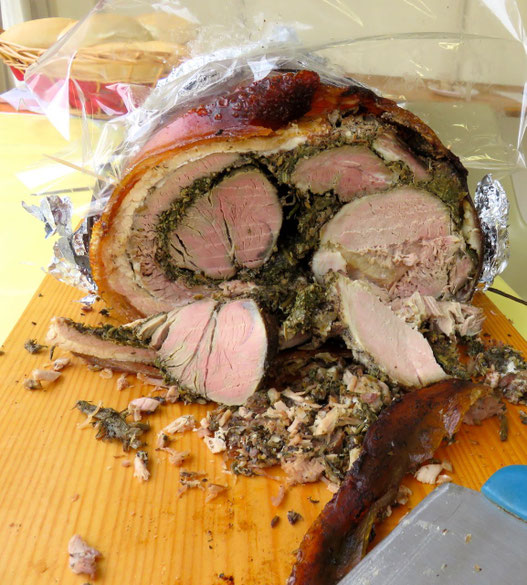 Porchetta (Pork stuffed with herbs like rosemary,  garlic and fennel). You can find it at every market!