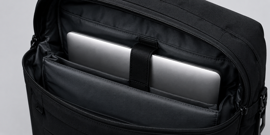 Business backpack with padded compartment securely protecting a laptop computer
