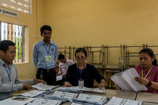 Counting ballots in Phnom Penh after voting stations closed on Sunday. (Credit: Adam Dean)