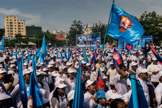 Supporters of the CPP listening to Mr. Hun Sen at a campaign rally in Phnom Penh on Friday. The 19 other parties contesting the elections are mostly tiny “firefly” parties that glimmer during campaigning and then disappear. (Credit: Adam Dean)