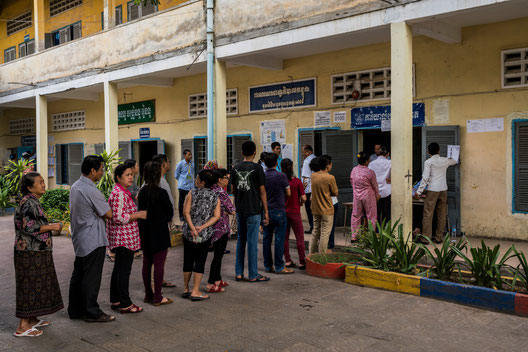 Voting in Phnom Penh on Sunday. Unlike in 2013, when a surge of youth voters almost propelled the opposition to victory, this election season was relatively devoid of energy. (Credit: Adam Dean)