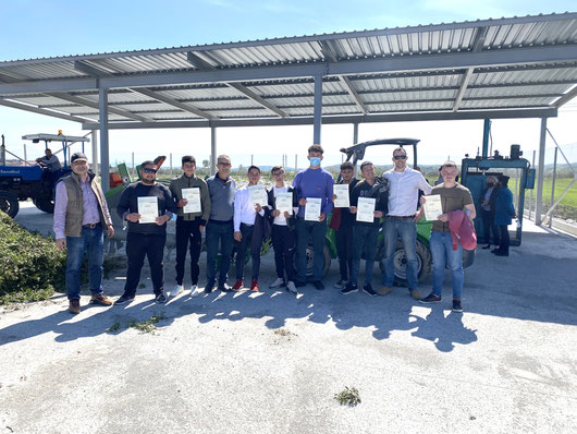 Participants holding their certificates of participation in the introduction to waste disposal site operation and management workshop in Cerrik