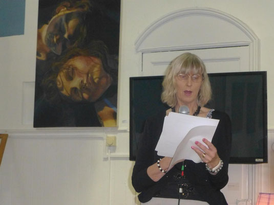 Julie Sampson reading poetry at book launch.