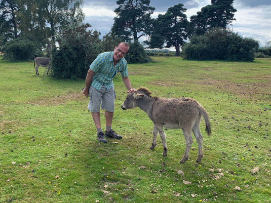 Choirmaster Martin making friends with a donkey.