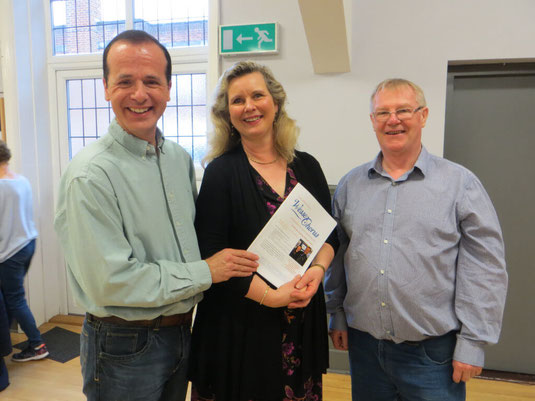 Gaynor Keeble smiling with the Music Director and chairman of the Wessex Chorus community choir.