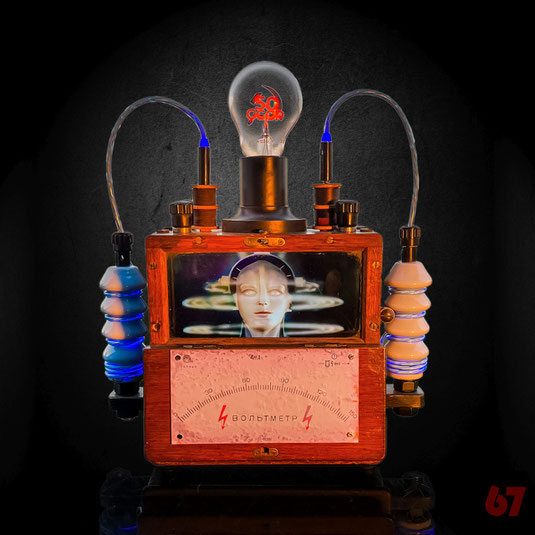 The Past Ahead is an assemblage artwork made of historic parts: Antique Russian Voltmeter, Glow bulb, Porcelain Insulators together with a modern IPS display