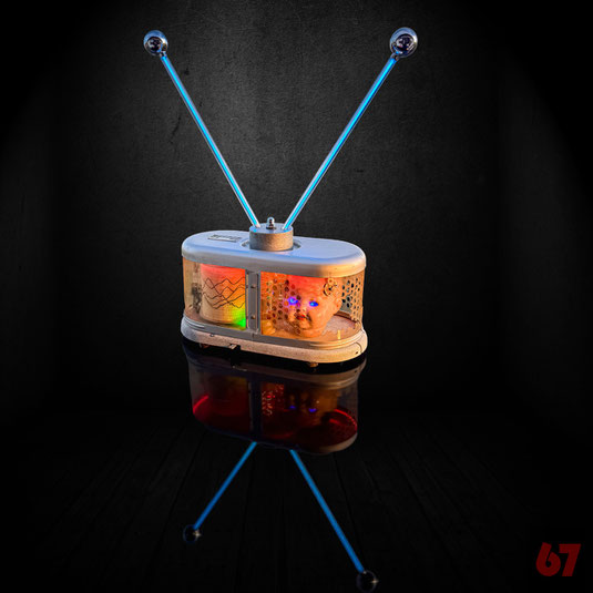 Assemblage artwork '#SelfTracking' with an 1950s thermograph, 1940s Schildkröt doll head, LED and CFFL illumination