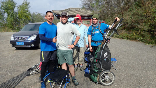 This is us meeting Wang Zhaopeng on the road at our lunch break. He was one of the first Silk Road Angels we met. When he's not driving cars for work he's running marathons all over China!