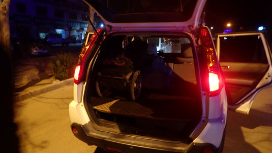 Our trailers being loading into the back of a cop van.