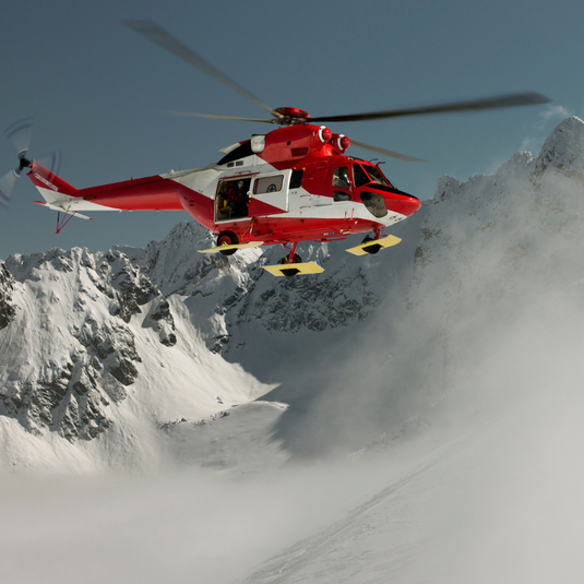 Mountain Rescue helicopter in mountains