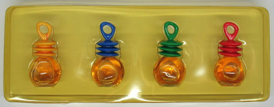 COFFRET NAF NAF COMPORTANT 4 MINIATURES AVEC BOUCHON PLASTIQUE DE COULEUR DIFFERENTE