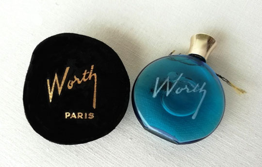 JE REVIENS - PARFUM 7 ML - LA MINIATURE CI-DESSUS DANS SON POCHON NOIR