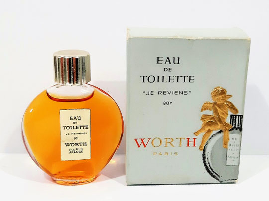 JE REVIENS - EAU DE TOILETTE 80° - FLACON LENTICULAIRE, AVEC BOUCHON PLASTIQUE DORE - BOÎTE A L'ANGELOT - ETIQUETTE DOREE VERTICALE SUR LE FLACON