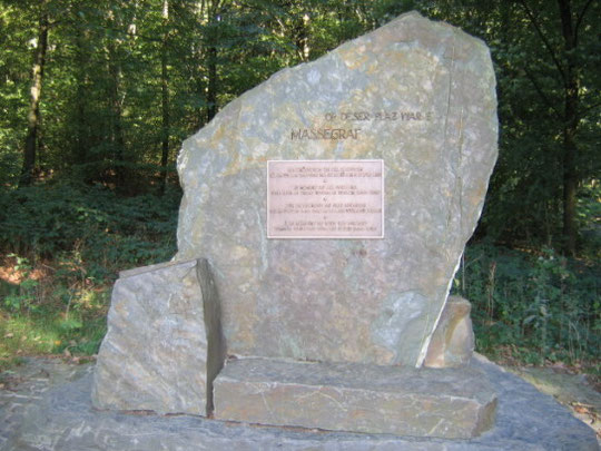 This memorial is named "Massegraf" (mass grave), located at the exact site, where over 160 German soldiers and several American soldiers had been temporarily buried together in 1945 pending removal and reburial. The escape fighting took place until Decemb