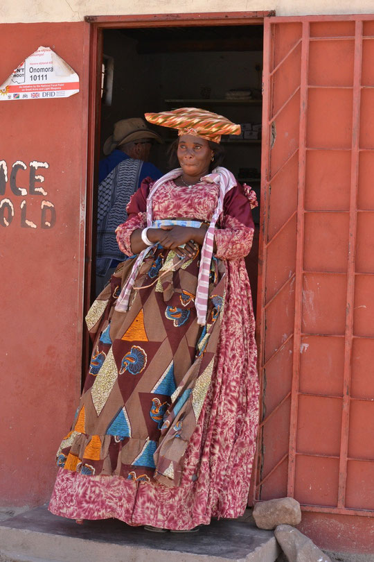 Herero woman selling ice cold beers in Orupembe