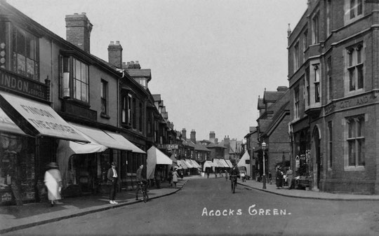 A view starting with part of the four-windowed set of shops beyond the Crescens Smith building, c. 1905