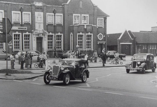 Vintage cars pass the New Inn, 1970s (Mike Wood)