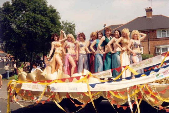 Stone Hall's float in the Acocks Green Carnival procession, adorned by the belly dancing class, 4th July 1987