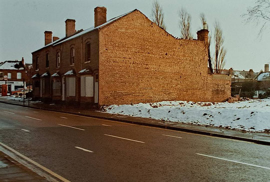 Numbers 1111-19 in 1983, with the chimney of number 1121 just visible (Hay Mills Project)