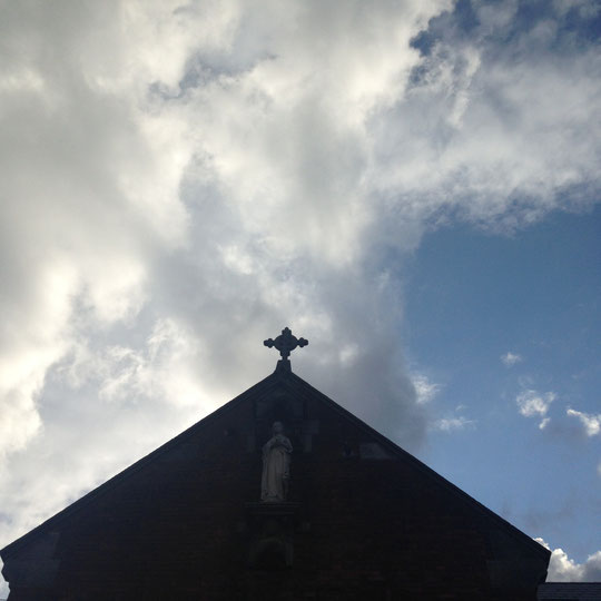 Celtic cross atop church