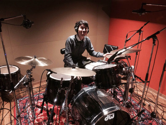 Gen sitting at his drums in the studio