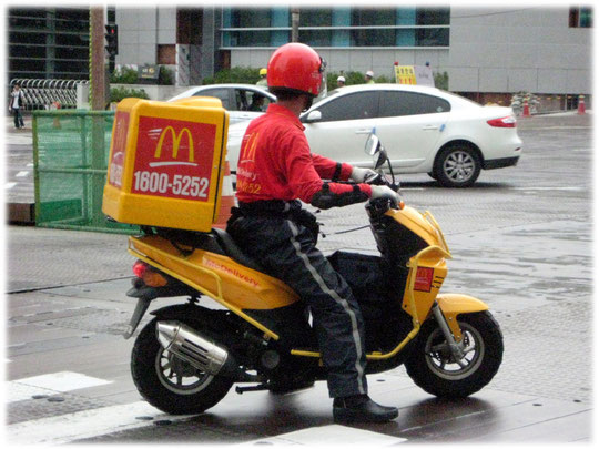 Photo about a Mc Donalds delivery service. Picture was taken in Seoul at the Gangnam area. Bild von einem McDonals Lieferservice in Südkorea. Essen to go und Fast Food auf Rädern. 