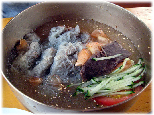 Photo about the Korean dish Mool Naengmyeon. This is a cold Korean soup with noodles. Bild von einer kalten koreanischen asiatischen Suppe mit Nudeln. Sehr delikat! Ein Standardgericht in Südkorea.