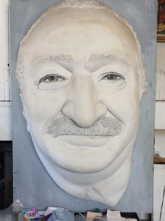 He’s carved out of wood and Durabond 90 and is similar to a coin relief. Made in 1989, 20 years 5x3 feet