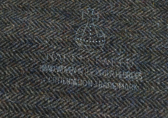 The Orb Trademark on brown Harris Tweed