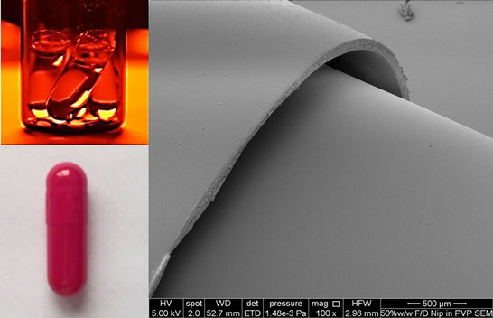 Photos of clear gelatin capsules filled with TBA, a capsule and a surface in high resolution