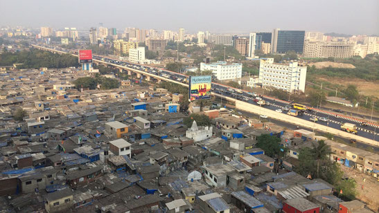 Yue Zhang. In Mumbai, a highway divides the “formal city” and the “informal city.” January 2016