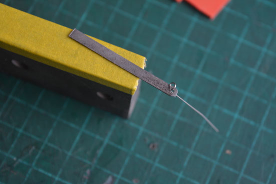 fit the wire loop through the reed