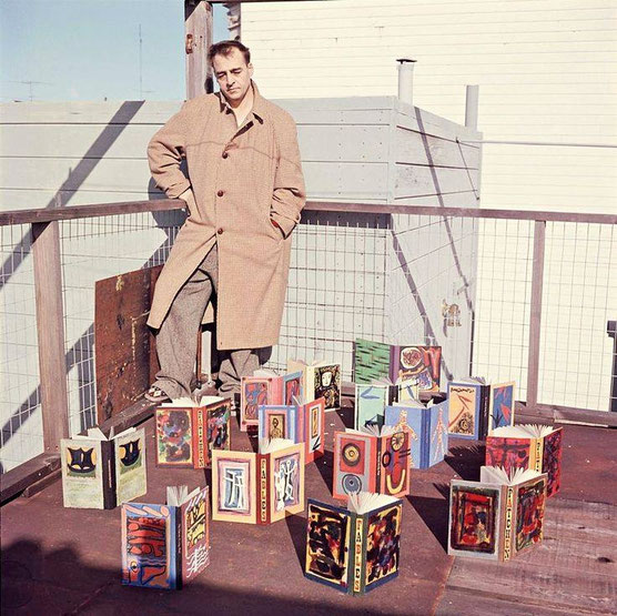 San Francisco poet Kenneth Patchen in 1957 with a collection of his painted books. The photograph was taken by the late photographer Harry Redl on the rooftop of his apartment house in San Francisco.