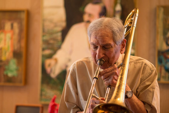 Henry playing his Bach trombone at home in Virginia