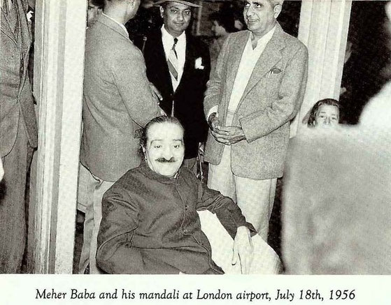 Eruch Jessawala, Nilu Godse & Adi K. Irani standing behind Meher Baba whilst waiting to depart for the USA