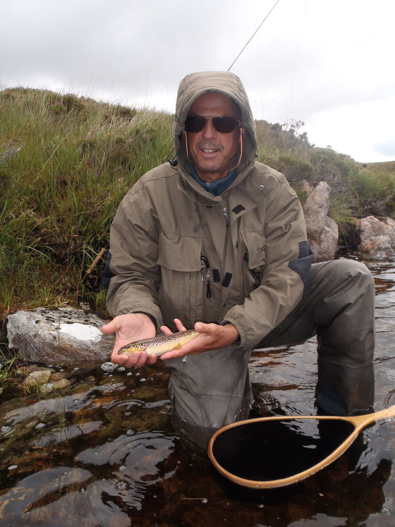 Erhard enjoying the loch trout before the cold got its teeth into him.