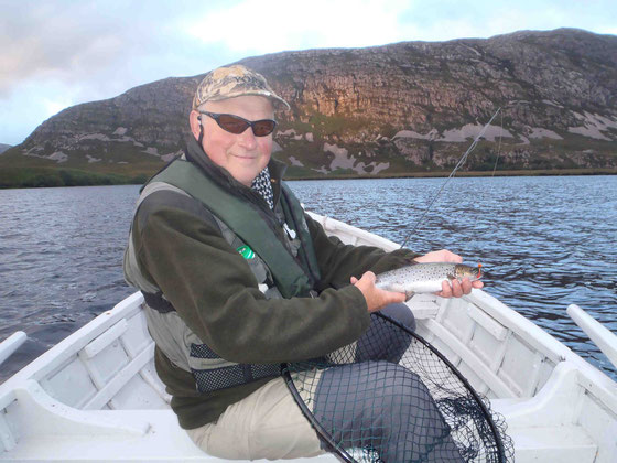 George with a fine sea trout on his orange football fly!