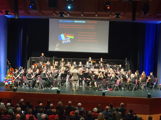 Oktober 2024: Jubiläum Städtepartnerschaften mit Épinay-sur-Seine und Rushmoor. Das MGO spielt in der Stadthalle Oberursel zusammen mit Musikern aus beiden Partnerstädten.