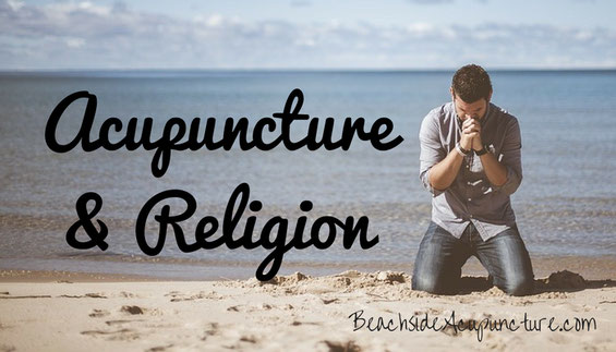 man praying at beach