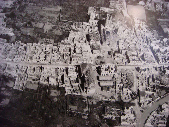 Sigolsheim after the Battle. The church in the right part in the middle. The large long house with the intact roof, was the German aid station and late CP of Major Vonalt.