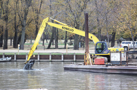 Crews from Newt Marine of Dubuque were busy at Spruce Creek Harbor last week removing 3,000 cubic yards of material from the water bottom. The $90,000 dredging project will create a better habitat for fish during the winter and provide a better flow in th