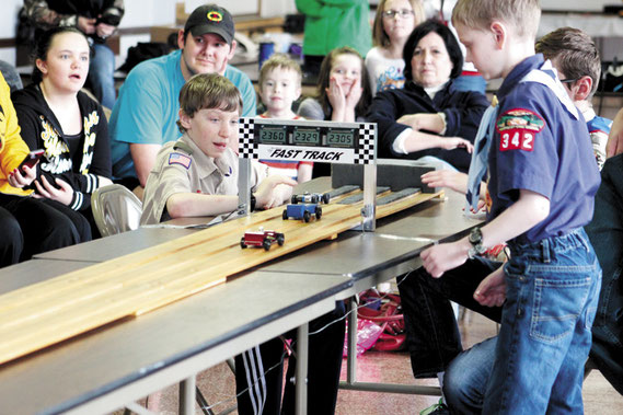 Scouts, parents, friends and relatives gathered around the Pinewood Derby track at the Bellevue American Legion Post last week to get a close-up look at all the racing action.