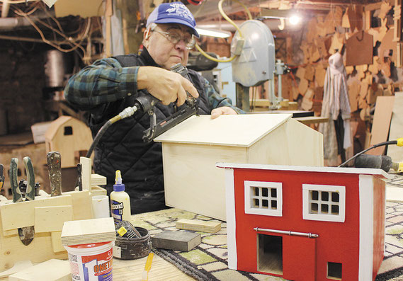 VInce Kilburg of Vince’s Toy Shop in rural Bellevue works on a toy barn for a Christmas order after completing a toy poultry shed for another family.