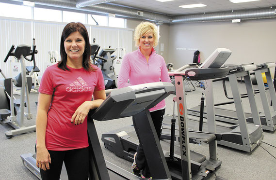 Melissa Roeder and Tonya Roeder give test out some of the equipment at their new venture called On Track Fitness.