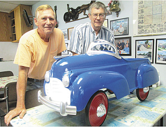 What’s old is new again. Milton Cornelius, left, with Eldon Hoerschelman at the Andrew Café and the restored 1941 Murray Steelcraft model of a Chrysler pedal car.