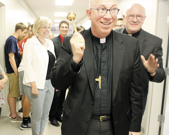 Archbishop Michael Jackels of the Dubuque Archdiocese sprinkled Holy Water in the new classrooms at Marquette High School last Thursday. The symbolic event signified that the work done on the new school was “In the name of God