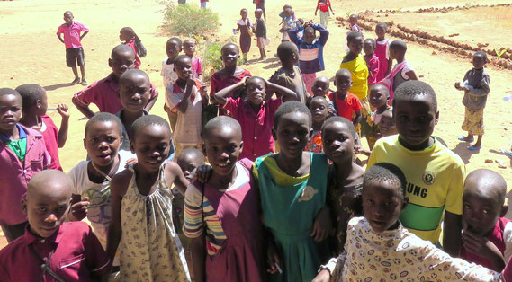 In a school in a village. Though there is shortage of rooms, teachers and stationery, the eyes on the children are shinning. (May 2015, taken by our staff)