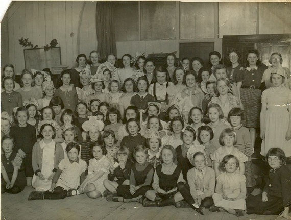 Evacuated families from Hartfield Crescent School dressed for a party